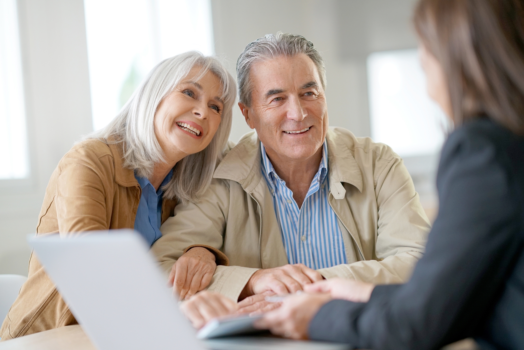 Older couple meeting with banking consultant