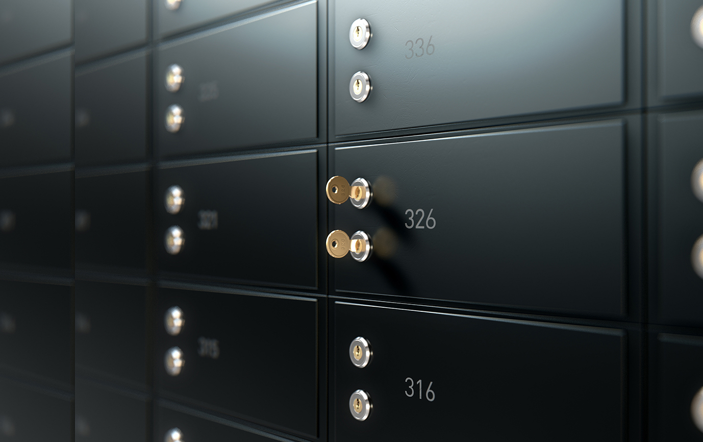 A closeup image of a few safe deposit boxes